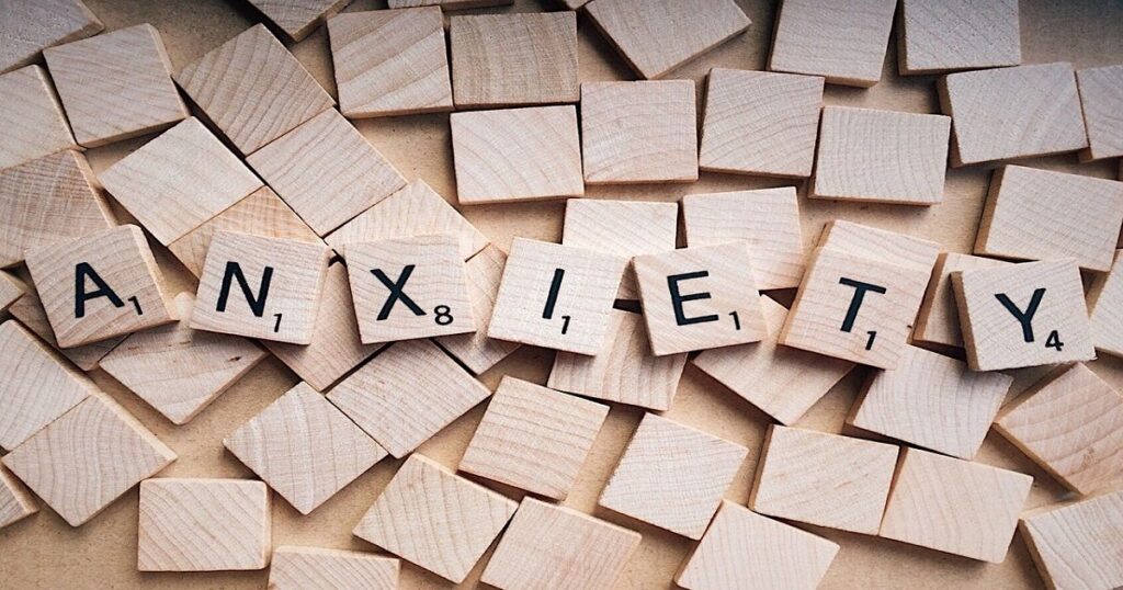 Negativity Bias - Anxiety in wooden letters - fallaciesoflogic.com